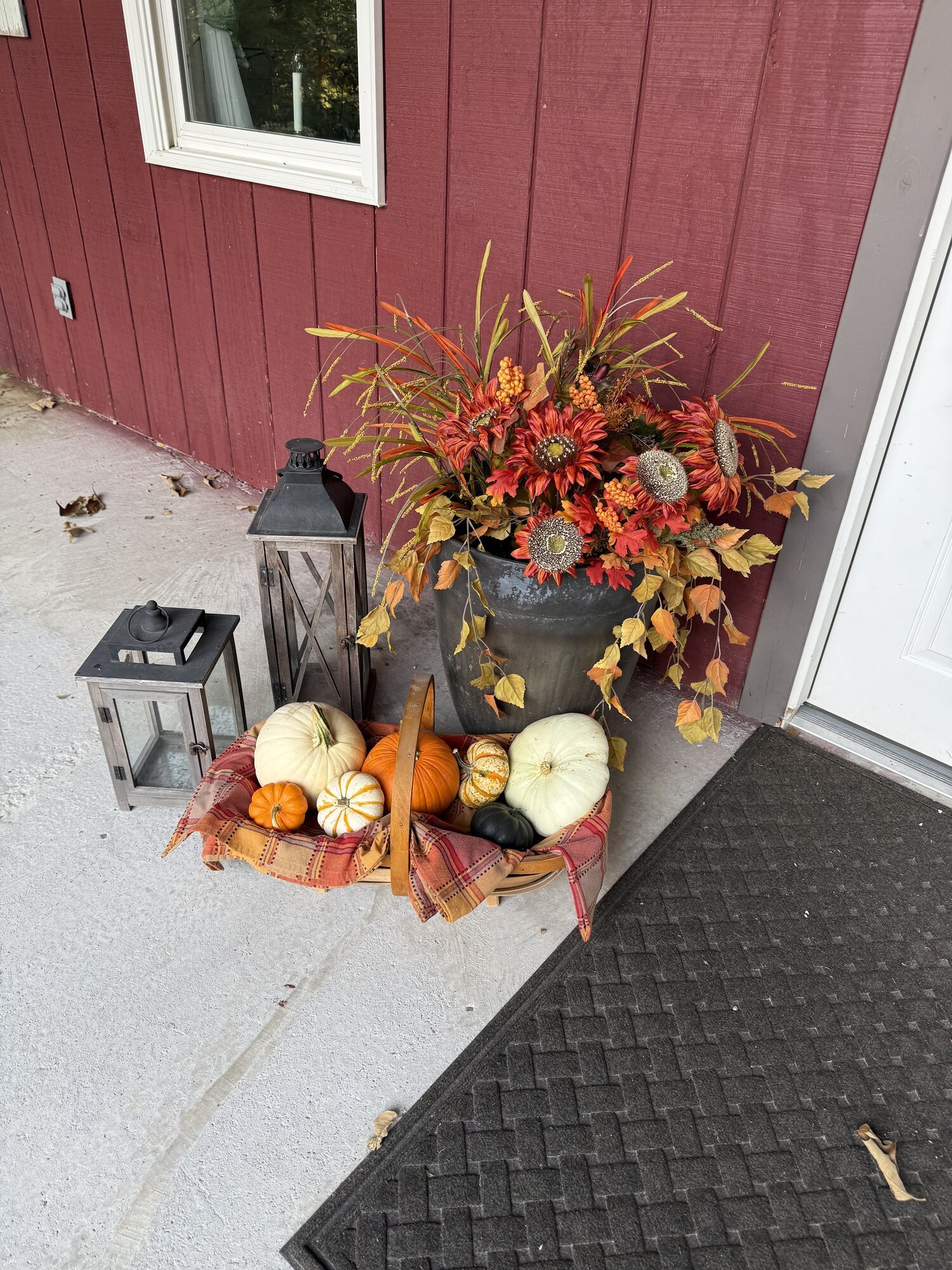 Fall lanterns and pumpkins by the Lodge back door